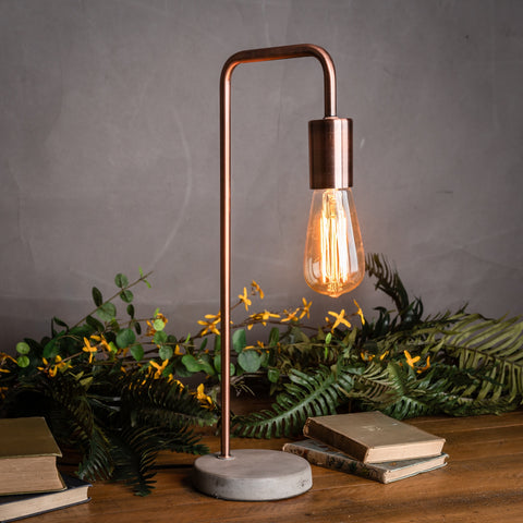 Industrial Style Copper Lamp with Stone Base and Rustic Appeal