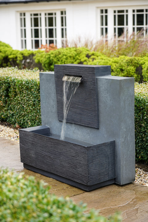 Elegant Outdoor Water Feature with Contemporary Design and Cement Finish