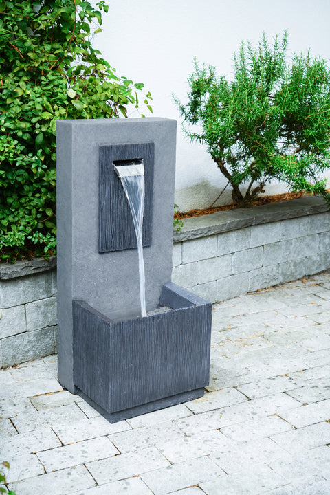 Elegant Outdoor Water Feature with Contemporary Design and Cement Finish