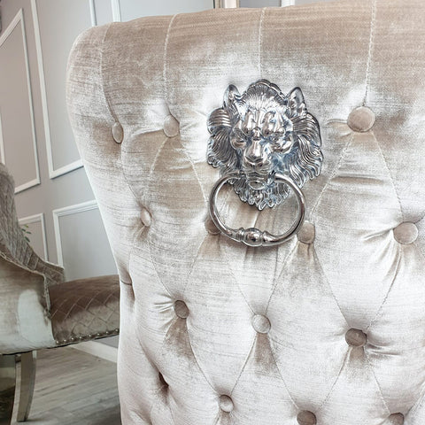 Classic Buttoned Dining Chair with Lion Knocker and Elegant Chrome Legs